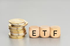 Cryptocurrency ETF concept. Stacked crypto coins and wooden blocks with text. Copy space
